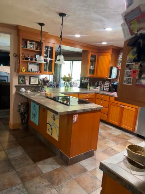 Wood kitchen — cabinets, counters and stove.